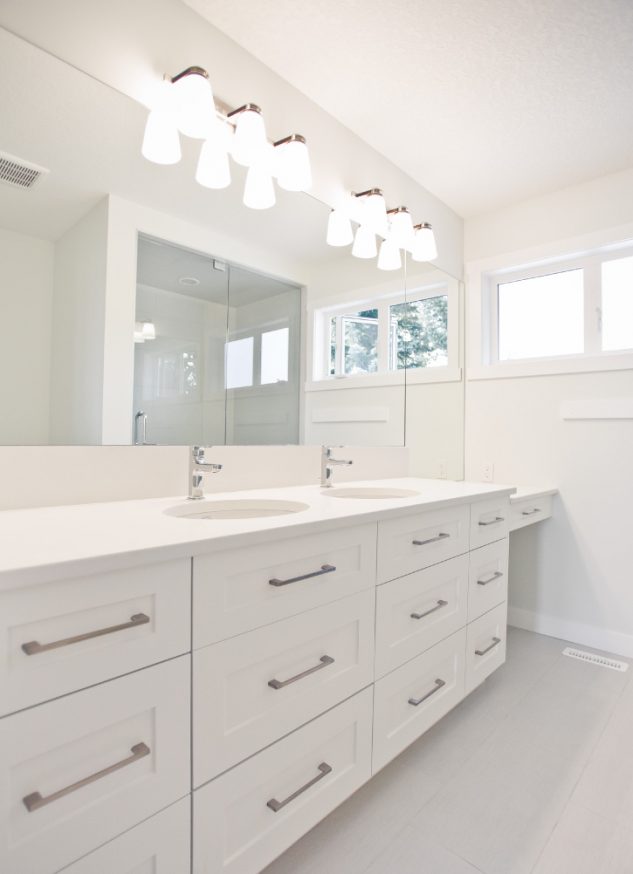 Bright and modern, this master bathroom was renovated to include dual sinks for him and her