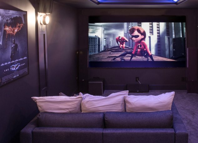 View of the screen from one of the elevated loungers in the home theatre