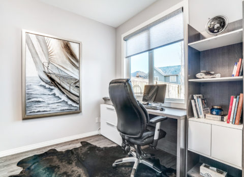 The basement is the perfect location for a home office with the large windows letting in lots of light