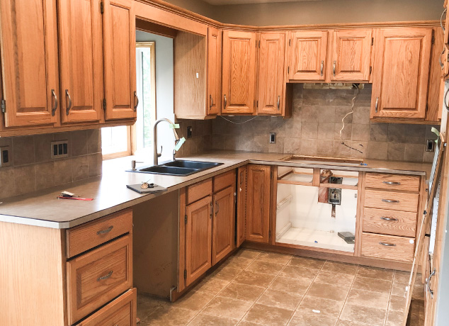 An outdated 1980s style kitchen pre-renovation by Melanson Homes