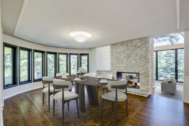 Dining room with stone fireplace