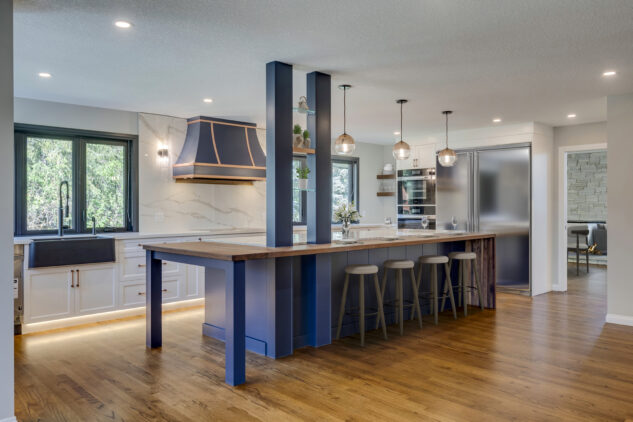 Blue kitchen island with quartz countertops