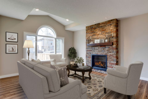Stone faced fireplace in living room 