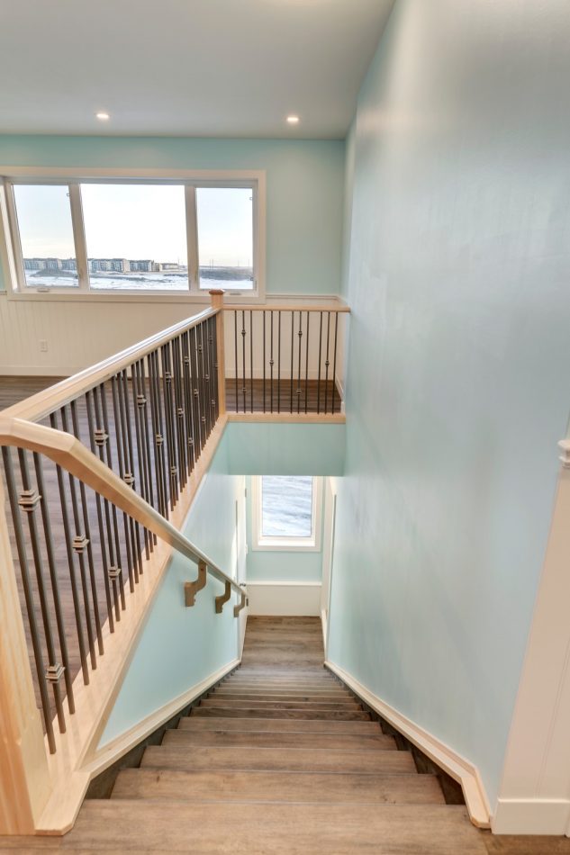 The staircase to the entryway of this custom built laneway home in Calgary