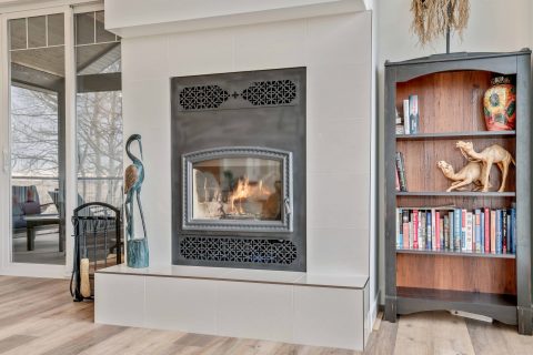 A modern fireplace completes this new acreage construction