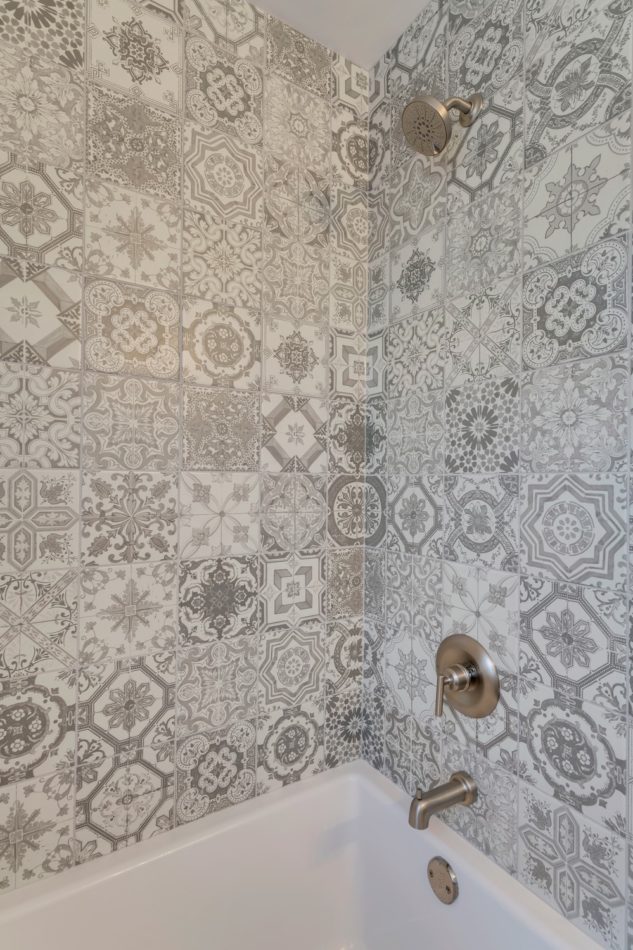 A gorgeous tile mosaic makes this master ensuite renovation stand out from the rest