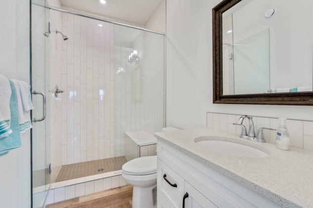 Custom built bungalow custom bathroom with walk-in tile shower