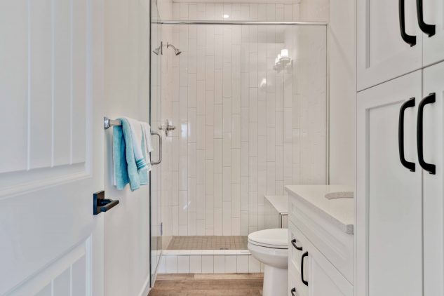 Brightly lit and spacious bathroom with a large tiled shower