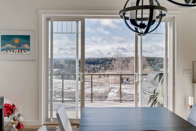 The gorgeous view of the countryside out the dining room window in this bungalow construction