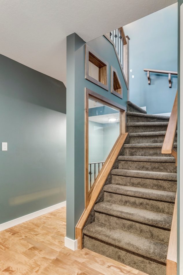 The newly built staircase that leads to the newly added third floor of this Calgary home
