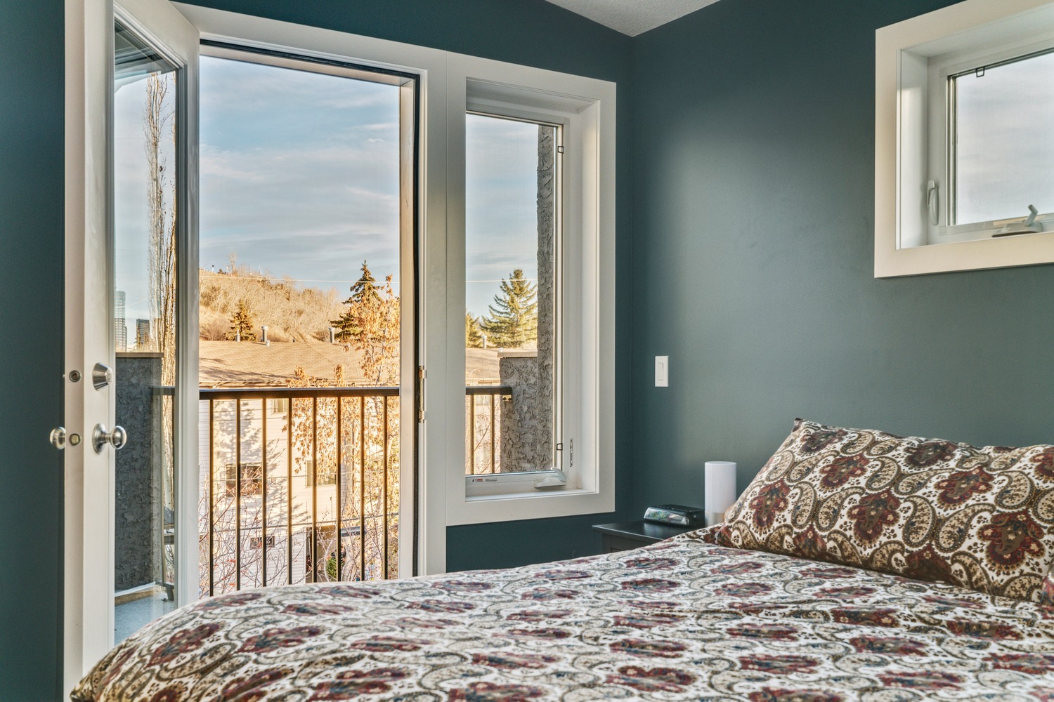 View overlooking Calgary from the third storey master bedroom in this inner-city home