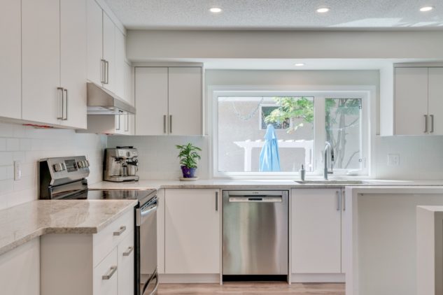 White kitchen cabinets with white subway tile