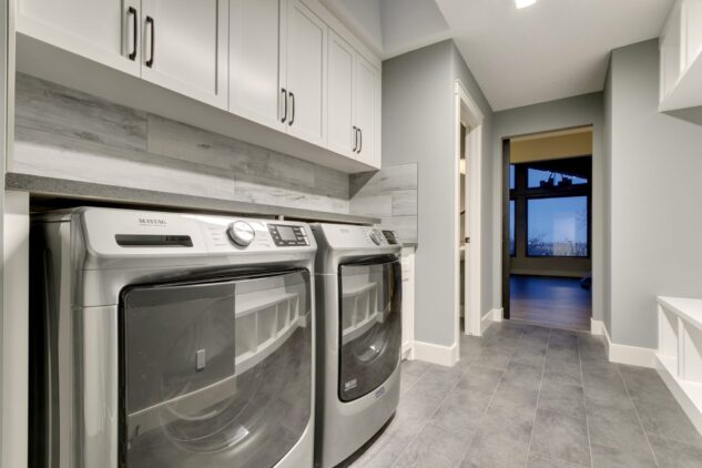 Laundry room with custom cabinets and mud room built-in