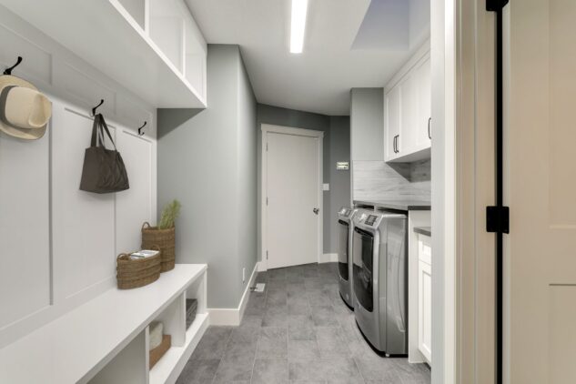 Laundry room with custom cabinets and mud room built-in