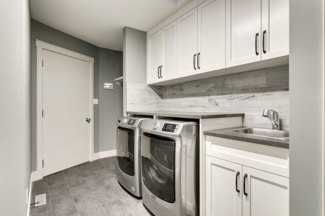 Laundry room with custom cabinets and mud room built-in