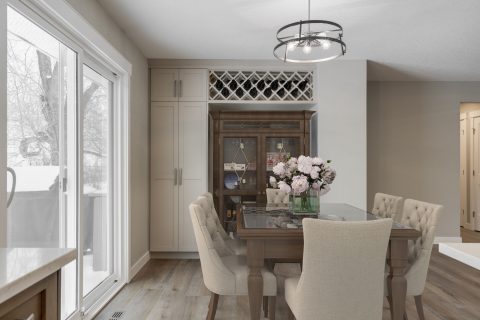 Dining room with custom cabinetry and wine rack