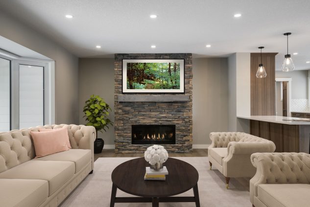 Living room with traditional furniture and stone faced fireplace