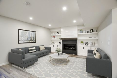 Large living room with gas fireplace, games table and seating area.