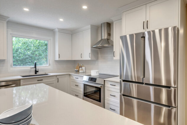 White perimeter cabinetry with white quartz countertops