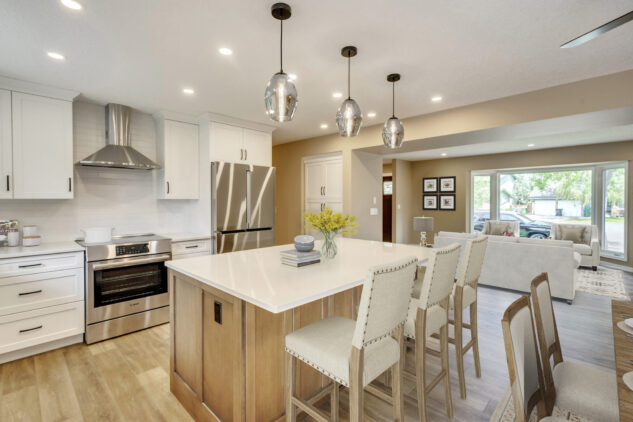 Stained kitchen island with white perimeter cabinetry. 