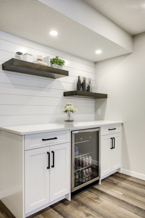 White Bar with stained floating shelves and shiplap detail