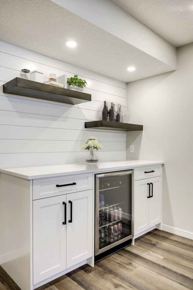 White Bar with stained floating shelves and shiplap detail