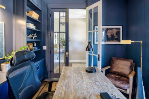 Front office painted in Benjamin Moore hale navy with custom built-ins and two-tone doors