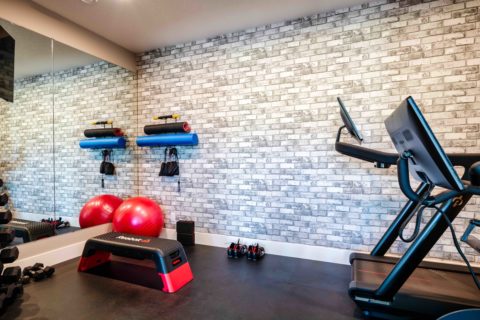 Gym with brick wallpaper