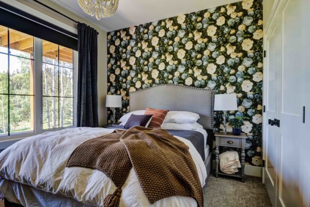 Spare bedroom with floral wallpaper and large aluminum clad window