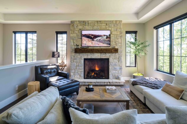 Old world stone fireplace with restored beam mantle 