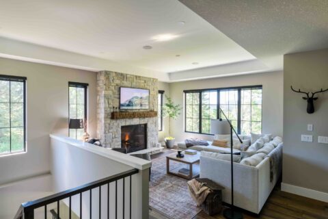 Living room with custom stonework and 42