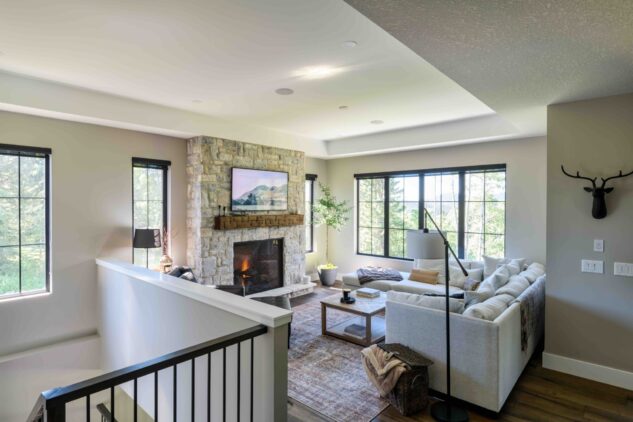 Living room with custom stonework and 42