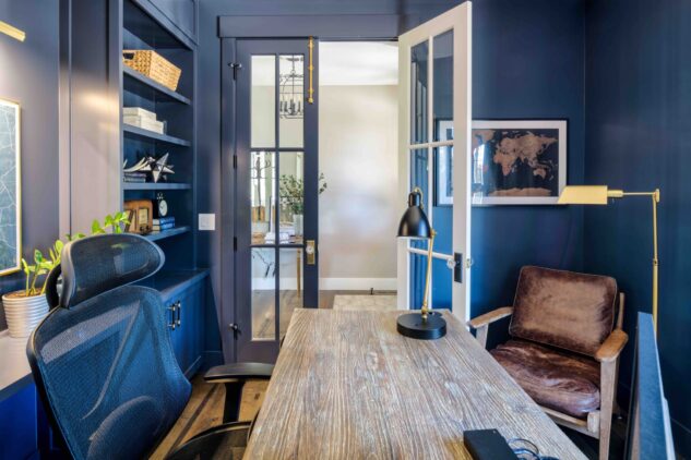 Front office painted in Benjamin Moore hale navy with custom built-ins and two-tone doors