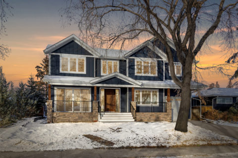 Custom infill in inner-city Calgary, Alberta. Calgary custom home builder featuring blue modern craftsman style home exterior