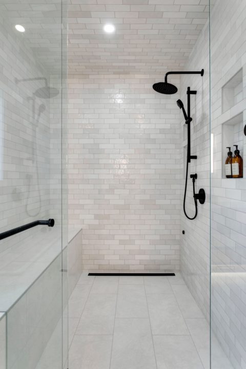 Custom infill home in Calgary, Alberta. Tiled steam shower with 10mm glass and black hardware