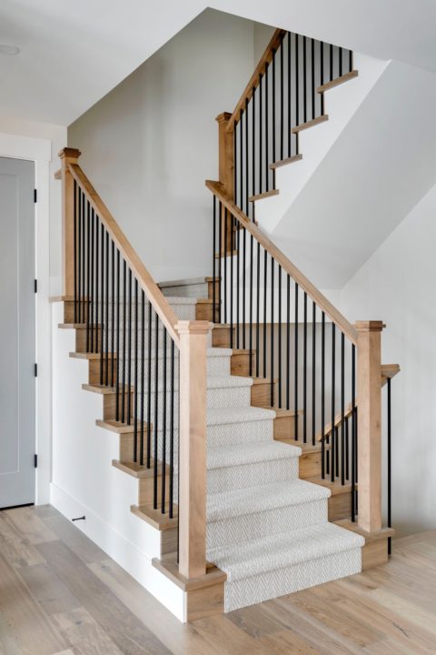 Calgary infill custom home builder. Eastern style staircase with carpet runner. 