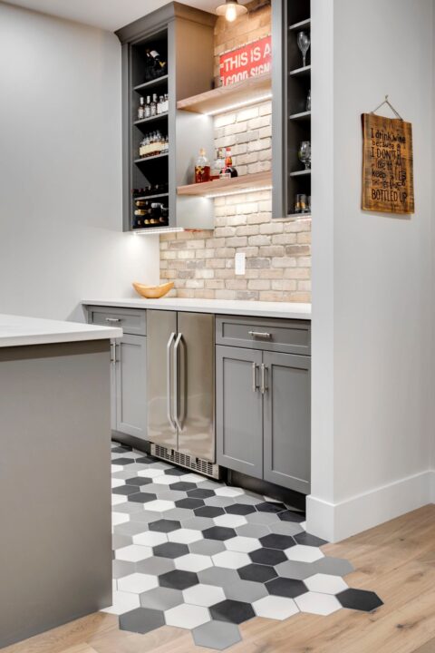 Custom bar with trickle tile into hardwood. Custom new home in Calgary, AB.