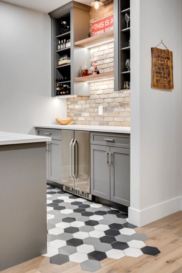 Custom bar with trickle tile into hardwood. Custom new home in Calgary, AB.