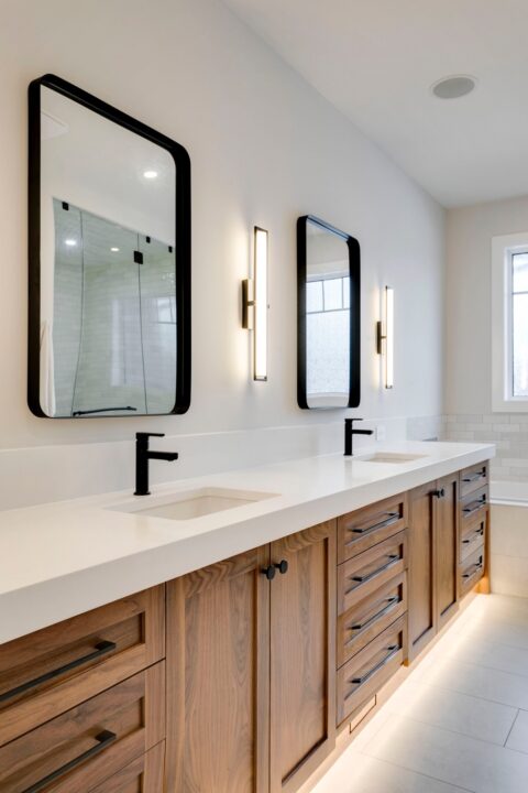 Ensuite with custom walnut vanity and 3