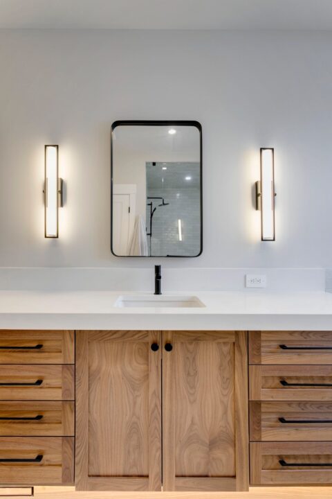 Ensuite with custom walnut vanity and 3