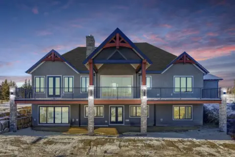 Exterior view of back of custom Dewinton home with walkout basement
