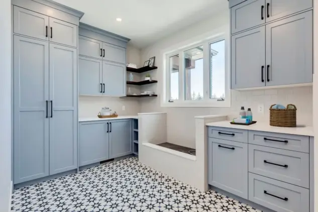 Mudroom of custom Dewinton home featuring custom Shaker cabinetry and dog wash