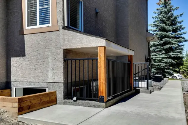 New separate covered entrance and window to legal basement suite in Calgary.