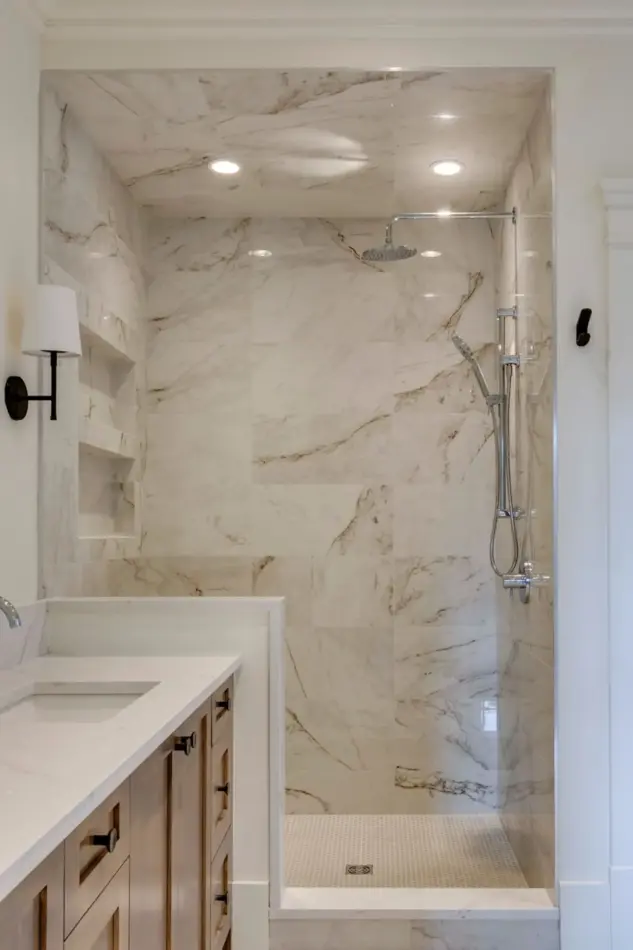 Closeup of primary ensuite shower with two niches