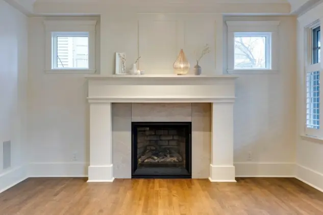 Close up of custom millwork gas fireplace surround