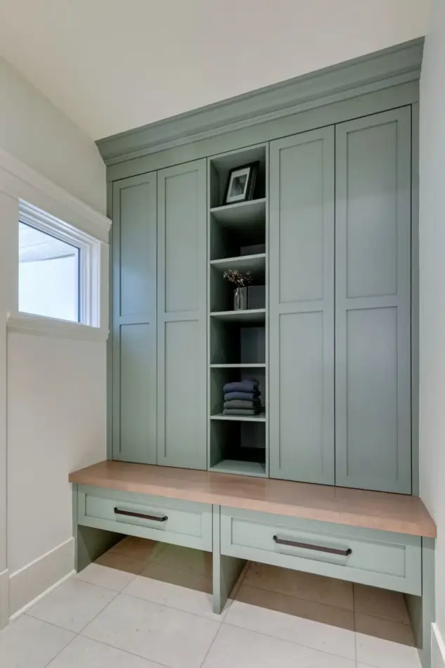 Mudroom with custom cabinetry and bench