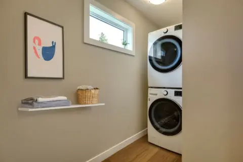 Laundry, storage room area in carriage home.
