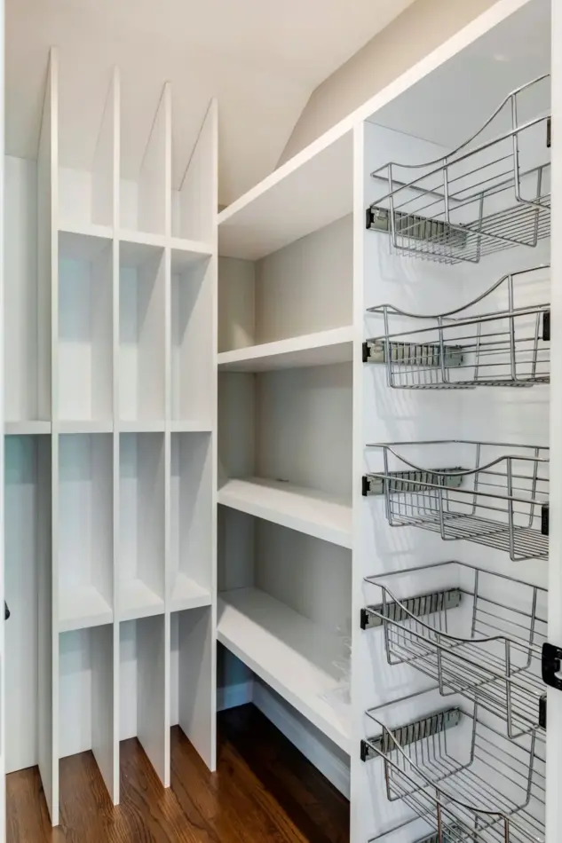 Custom pantry shelving and pull out baskets in renovated Rocky View County home