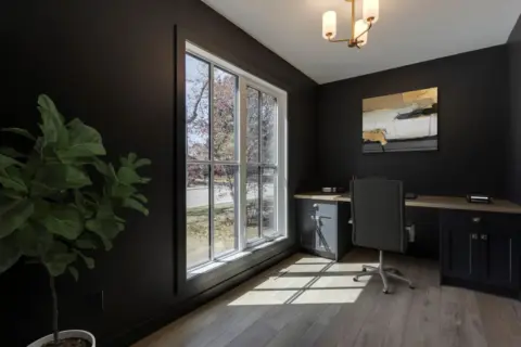 Dramatic dark finishes and custom desk in Wildwood Calgary home, remodeled by Melanson Homes