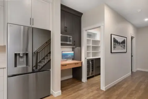 Tech station and butler's pantry adjacent to fully renovated kitchen in Cranston home